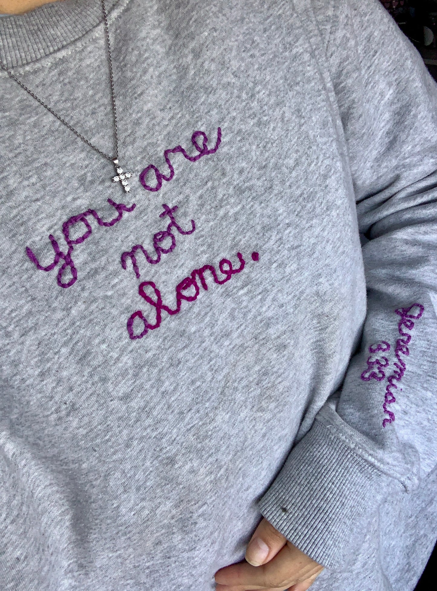 Hand Embroidered “you are not alone.” Crewneck