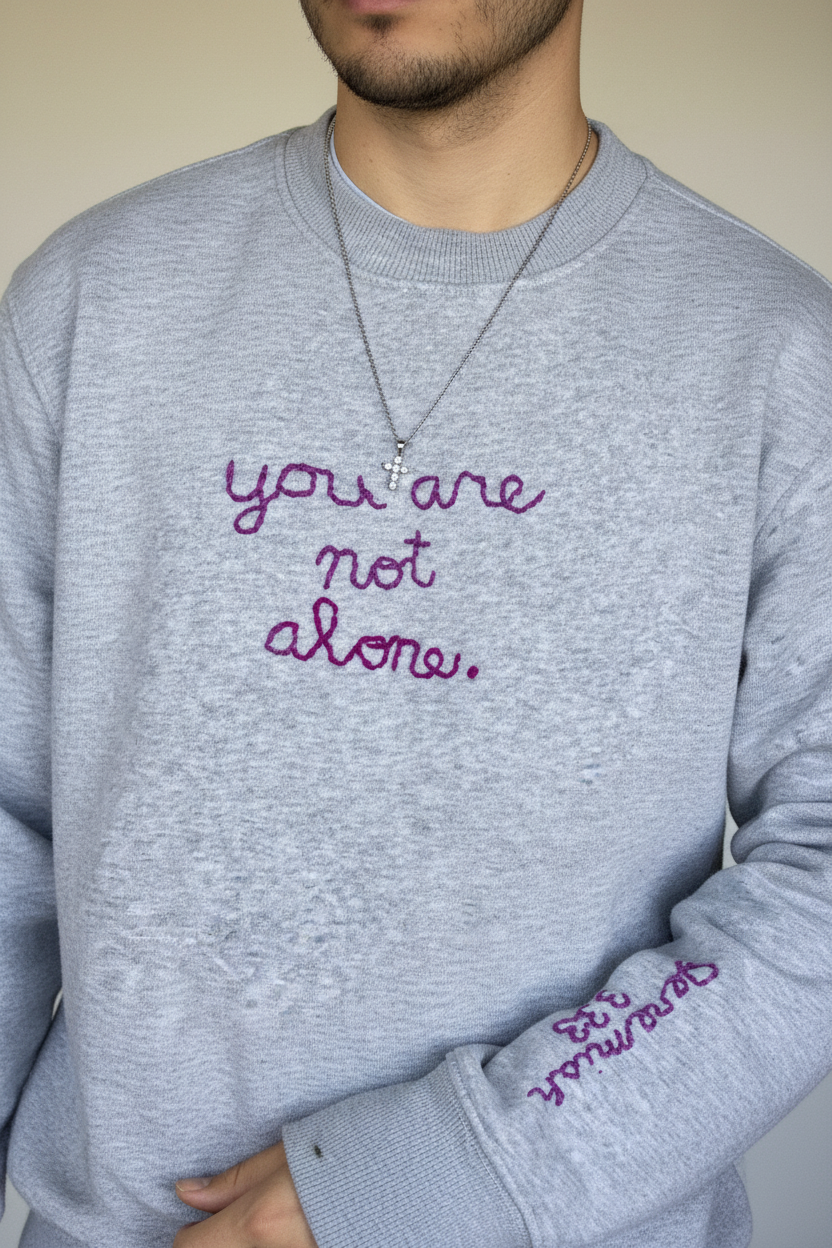 Hand Embroidered “you are not alone.” Crewneck